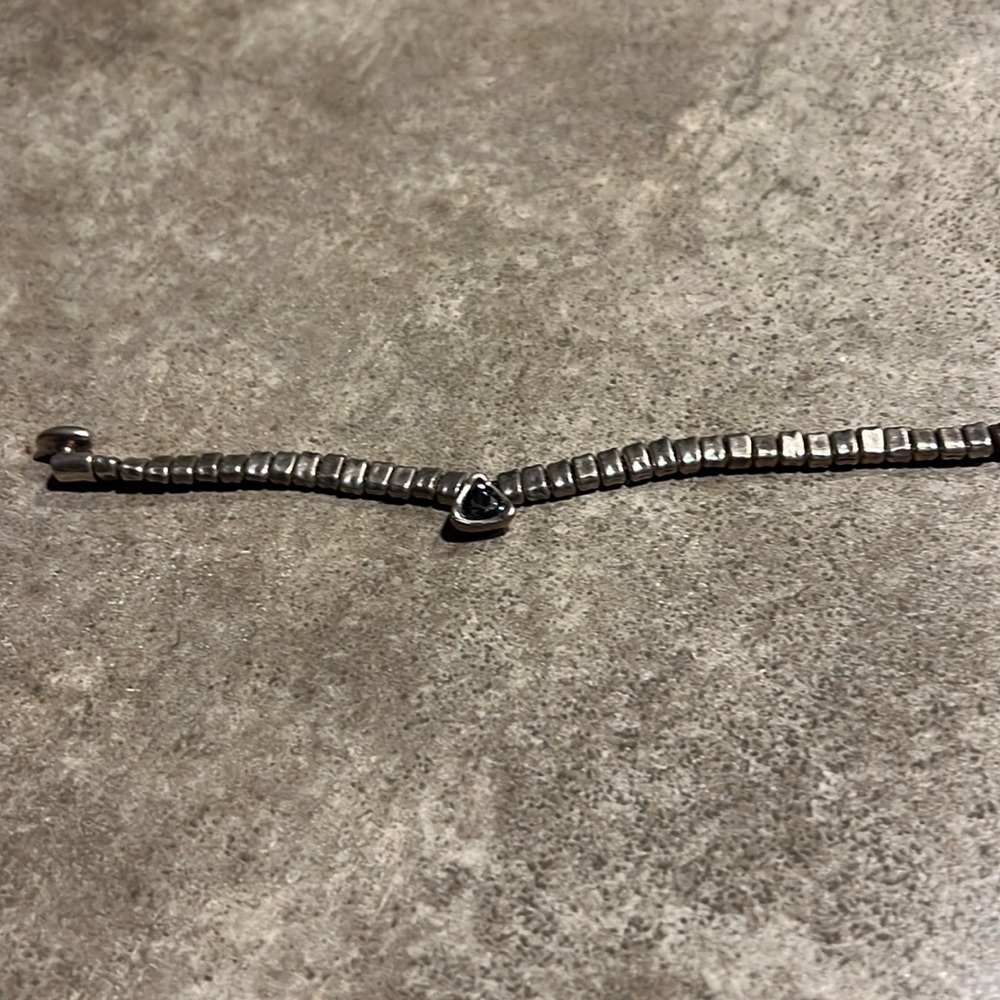 Uno de 50 bracelet. Leather clasp. Stone color looks blue.